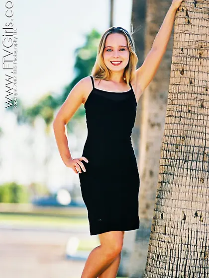 Lillian Lee poses in her sexy tight black dress and shows off sh