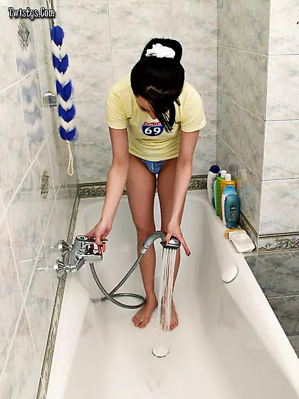 Hot teen chick Stacy strips in the shower and shows us her fucka