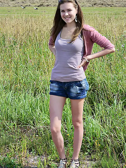Near stack of hay good-looking teen decides to relax fully naked