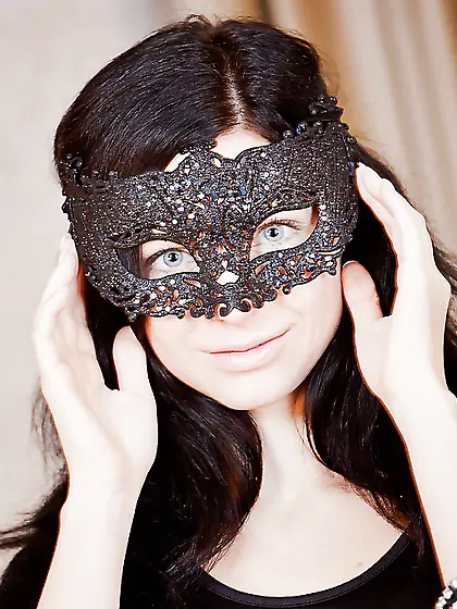 Mysterious blue-eyed brunette in bizarre panties and black mask