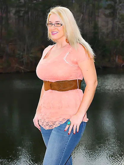 Erotic outdoor session of stunning blonde MILF showing big breas