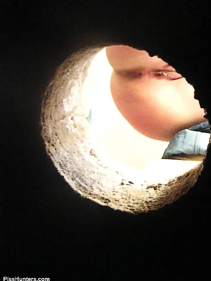 Meaty peeing pussy shot through a hole