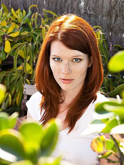 The coach is staying in the yard and the pretty doll Mia Sollis