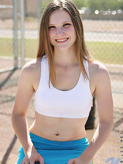 Impressive teenage model pulls up her top and displays her natur