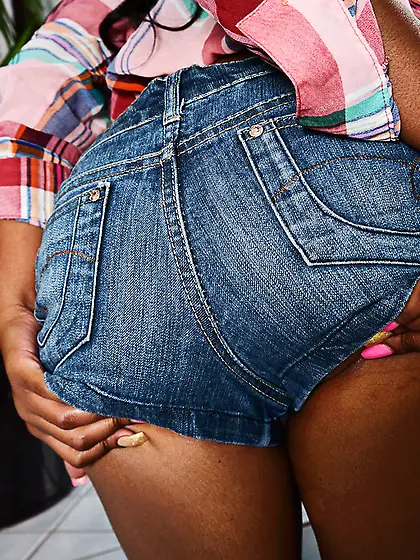 Young black woman is too beautiful to hide her charms under the