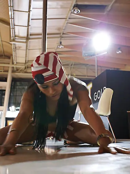 Tempting stripper flaunts her naked body while performing hot po