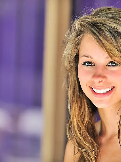 Perky booty nudist showing off her firm ass while roaming the st