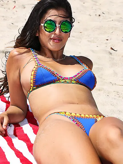 After tanning on the beach,  Latina oils herself in the hotel and