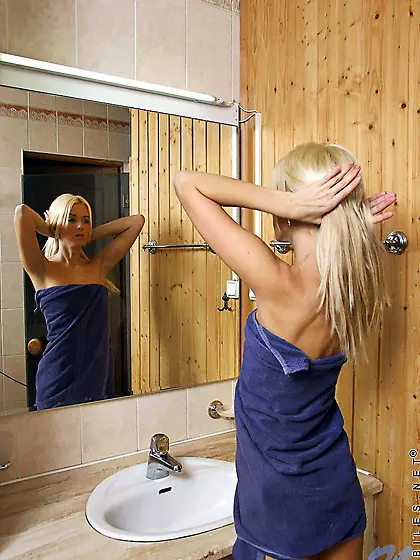 Petite blonde Kaleena Nubiles demonstrates her pink pussy and ti