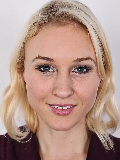 Blonde chick has different-shaped breasts and red hair on pubis