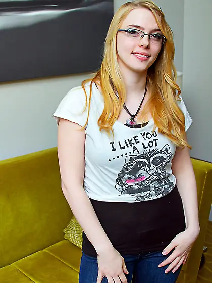 Beauty with glasses looks sexy when stripping to lingerie to sho