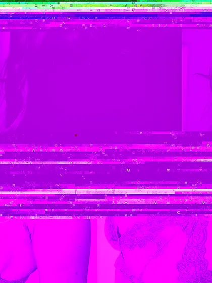 Blue-eyed doll Hannah Hilton in pink lace lingerie displays her