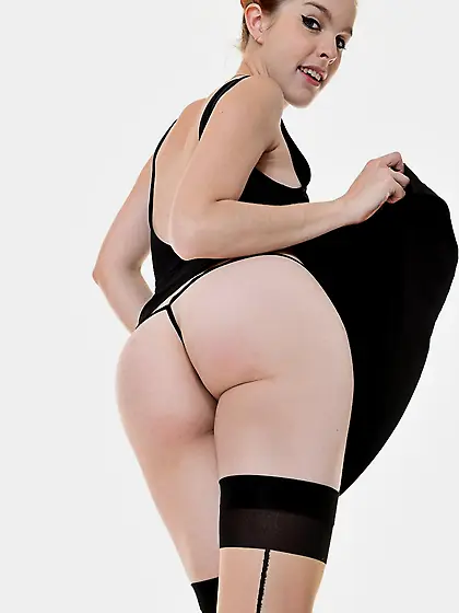 Redhead beauty Amarna Miller is pulling up her sexy black dress