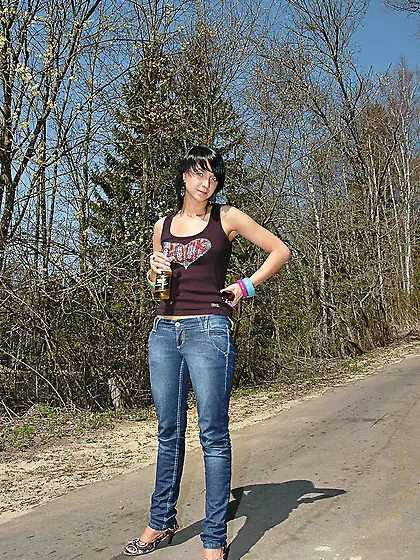 Outdoor pissing on asphalt path