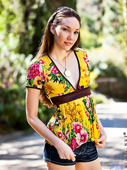 Aria Amor gets naked and spreads her tight bald pussy open in th