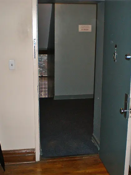 open door in front of stairs and elevator