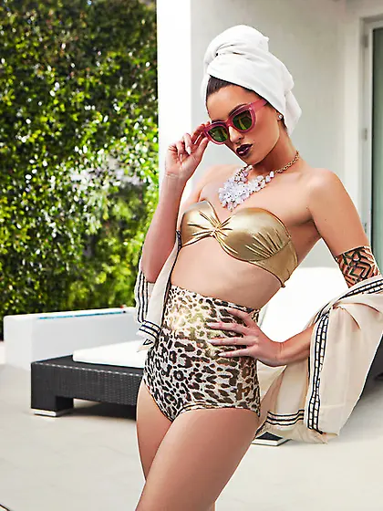 Golden beauty takes bikini