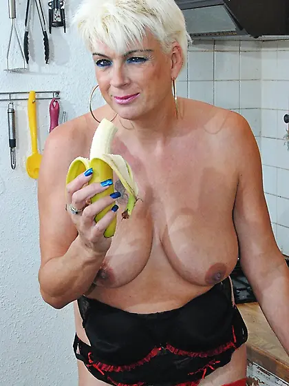 Blonde cougar stuffs foods