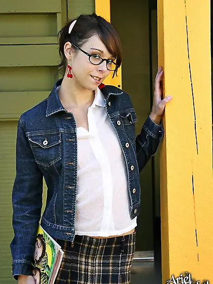 Four-eyed schoolgirl Ariel Rebel bares her tiny tits and shaved