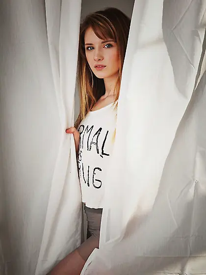 Female serves fans posing topless and tearing pantyhose to bare