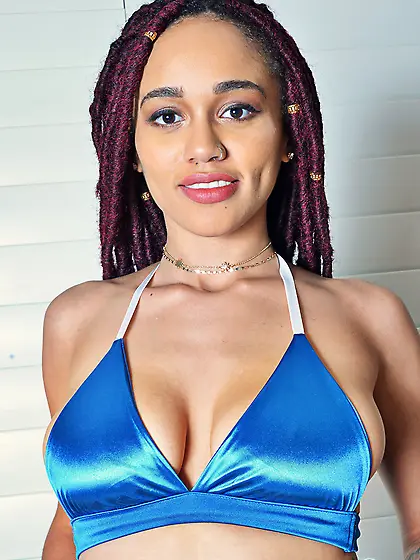 Ebony girl Julie Kay with red dreadlocks in blue bikini gives he