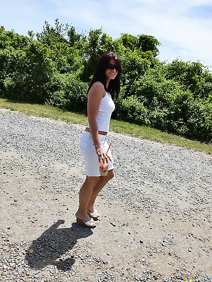 Ann Angel strips all of her clothes before the camera and shows