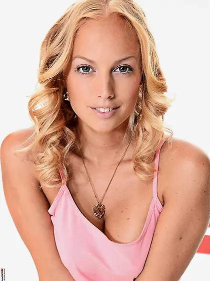 Sexy golden haired hottie Melody Powers poses on the chair and s