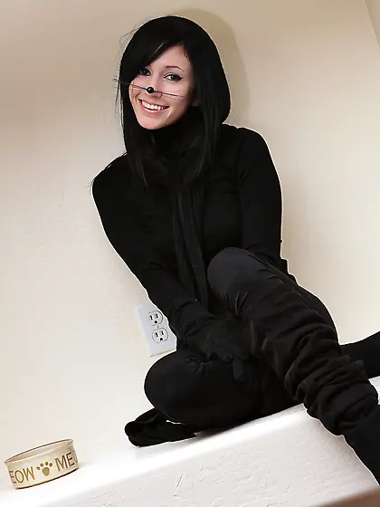 Adorable brunette poses like a kitty who loves to show assets on