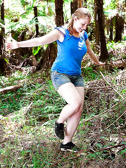 Plump female walks in a forest and exposes saggy boobs and shave