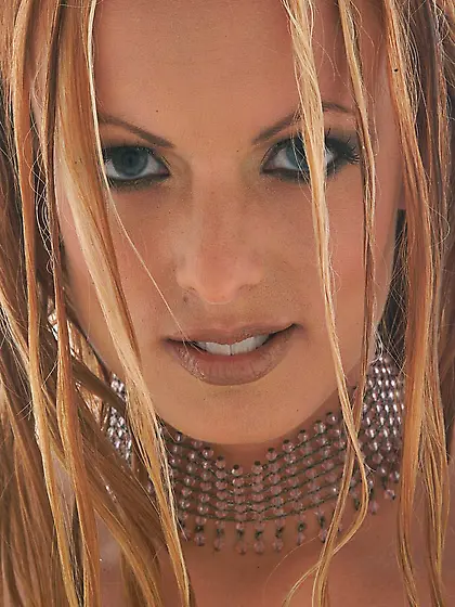 Busty blonde babe Stormy Daniels strips her white lingerie and s