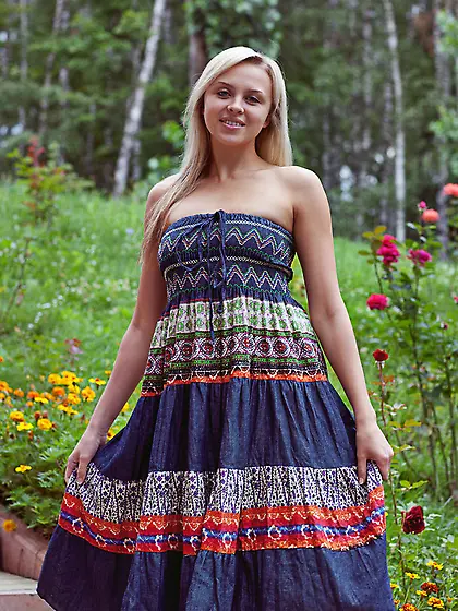 Blonde poses stairs woods