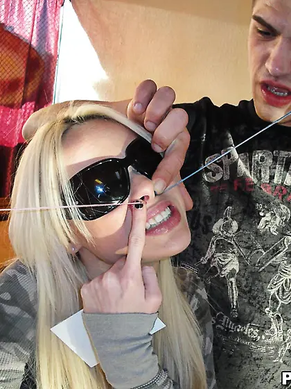 Blonde Rebecca Blue licks the long stick and then climbs and hea