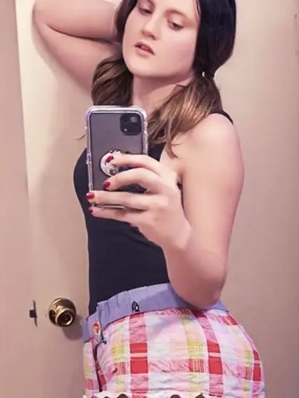 Cute Tranny with Pigtails in Plaid Shorts