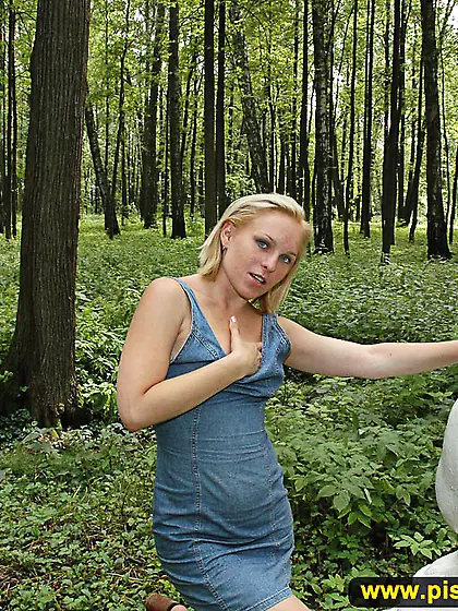 Pissing outdoor on a statue