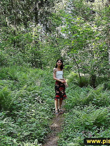Teen brunette pissing outdoor in the forest