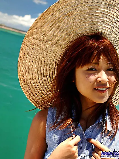 Smiling Asian girl Asuka Idols is bathing in bikini but then dec