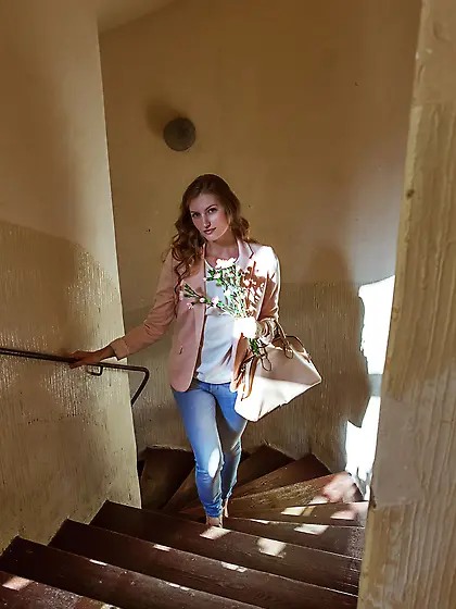 Leggy blonde takes off her skinny jeans to pose naked on a bed V