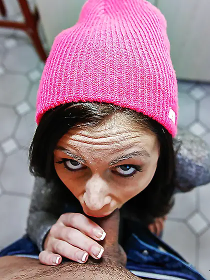 Beanie wearing babe maintains eye contact during hot sucking