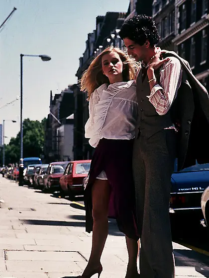 Two classic chicks fuck a big cock on a sofa