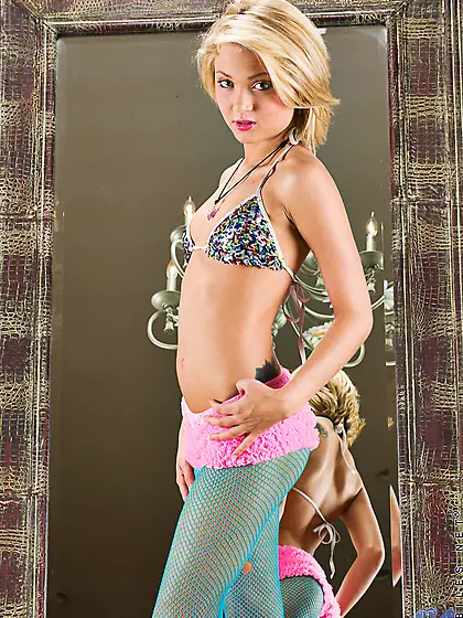 Naughty blonde in blue fishnet pantyhose Dakota Skye is masturba