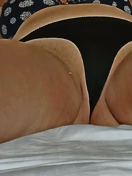 wife ass inblack panties in bed