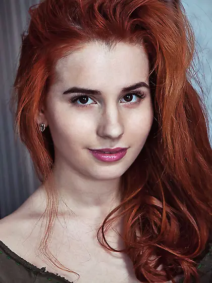 Redhead with a pale body shows her enticing holes up close on a