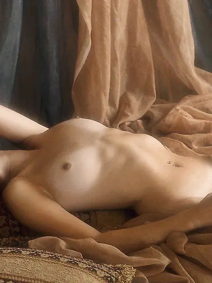 Charming brunette with natural breasts posing seductively for th