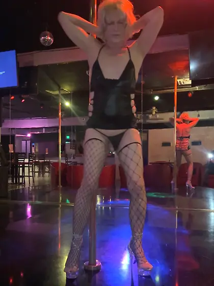 Shemale dancer shows off her cock during a striptease
