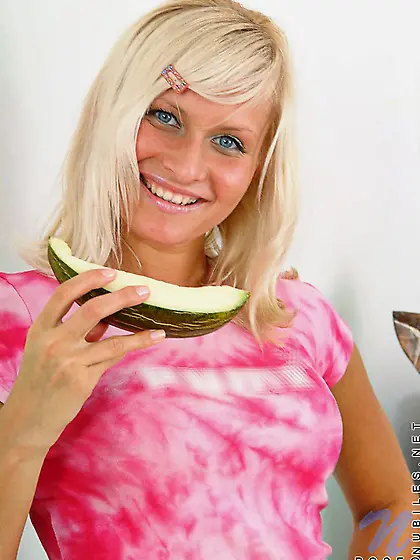 Super cute babe eating a watermelon and displaying her perfect b
