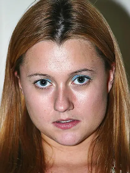 Ginger Lee gives a closeup of her shaved pussy while exposing he