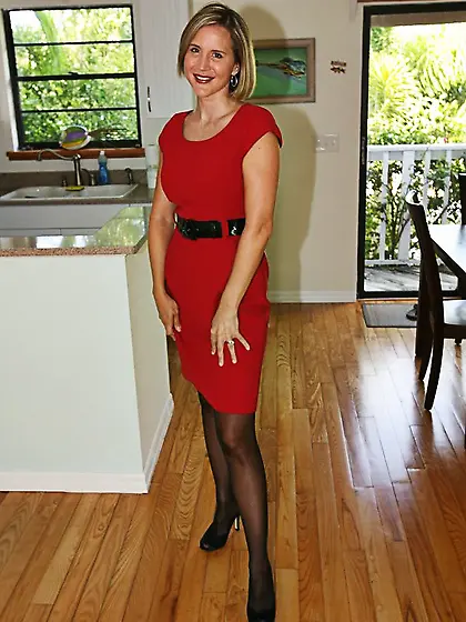 Lusty milf Desirae Spencer taking off red dress and posing in th