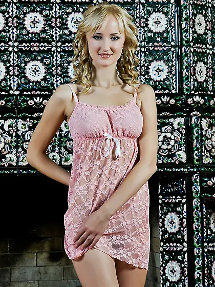 The naughty blonde Zemira A is looking into the camera and keepi