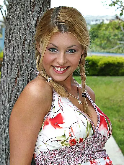 Big titted blonde Ginger Jolie takes off her red skirt and panti