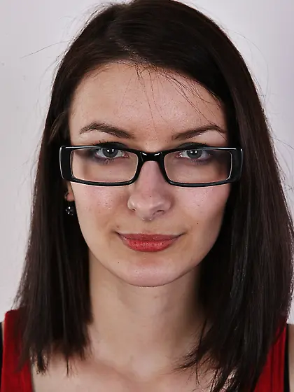 Beautiful young woman with glasses has middle-sized tits that mu